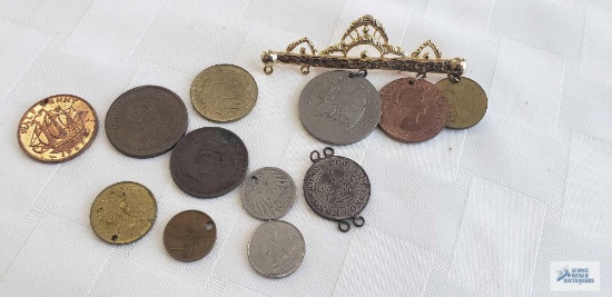 Brooch with foreign coins and extra coins