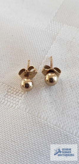Gold colored stud earrings, marked 14K JCM