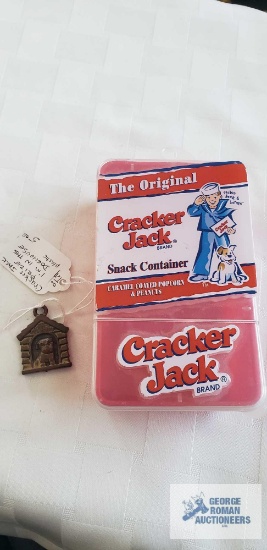 Cracker Jack snack container and Cracker Jack prize plastic dog in the dog house