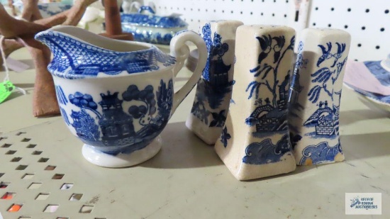 miniature creamer made in Japan and two pairs of blue/white salt and pepper shakers. one of them has
