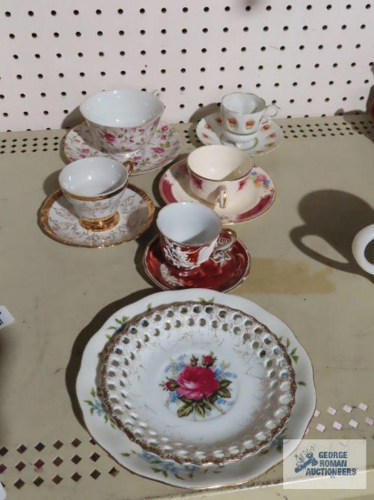 lot of cups and saucers with extra plates