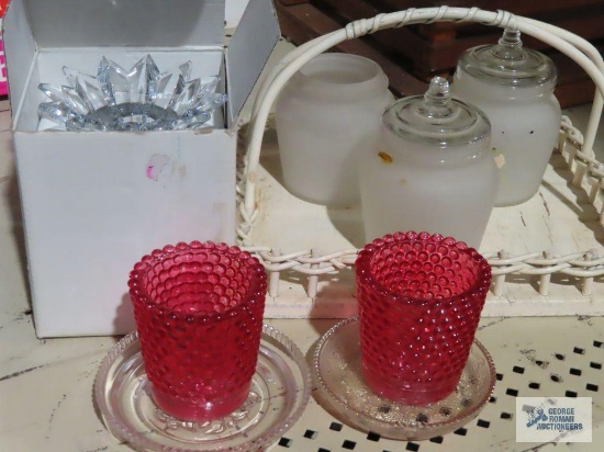 white wicker vanity tray, frosted jars, candle holders, and a pair of Mikasa candle holders