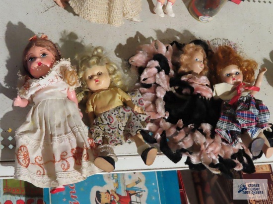 Lot of vintage plastic dolls. One is missing a shoe. Two have open/closed eyes
