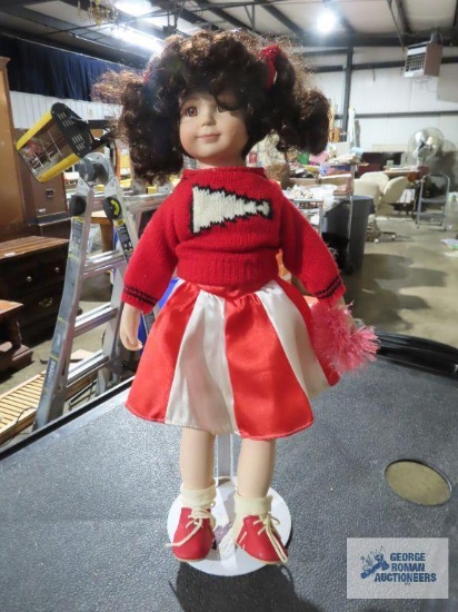Cheerleader porcelain doll with stand