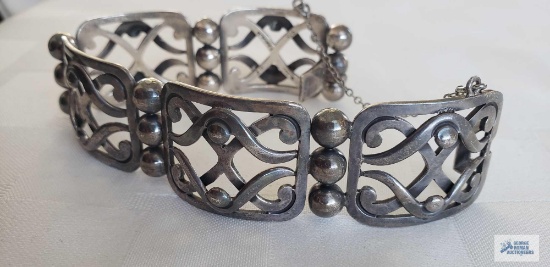 Wide silver colored bracelet, marked 925