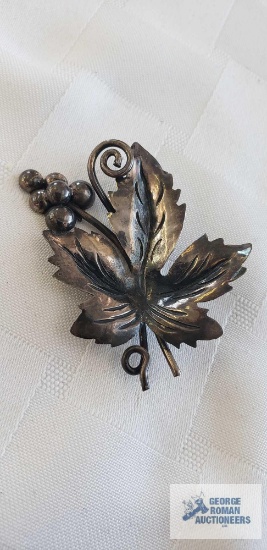 Silver colored leaf with berries pin, marked Mexico 925