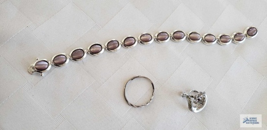 Silver colored purple stone bracelet, glass needs repaired. Single earring, marked 925. Other single