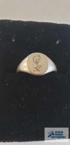 Silver colored ring, monogrammed L, marked Sterling
