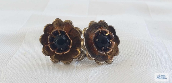 Gold colored floral with red gemstone screw back earrings, marked Sterling