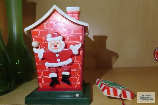 50s Christmas decoration that lights up and Santa dances and the ball moves. 50s pin, when the bell