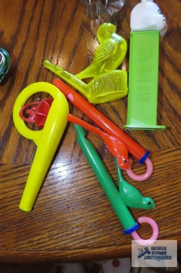 children's whistles and Pez container