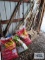 Lot of mulch, plastic buckets, wooden crate, fence post and etc