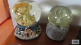 Two musical snow globes