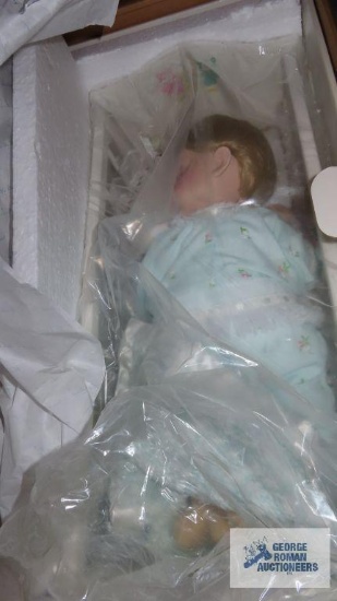 Danbury Mint doll in cradle