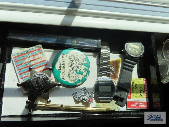 Miscellaneous items, including watches and Saint Patrick's Day pin