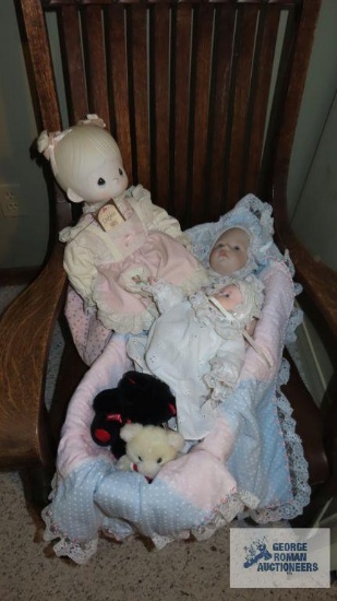 Precious Moments doll. Small bears and baby dolls in woven basket