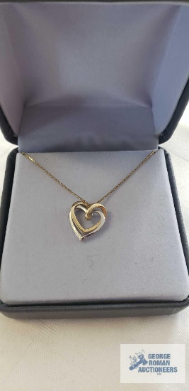 Gold and silver colored heart pendant, marked 14K on gold colored chain, marked 14K Italy,