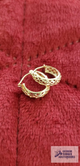 Gold colored cut out hoop earrings, marked 14K,...approximate total weight is .85 G