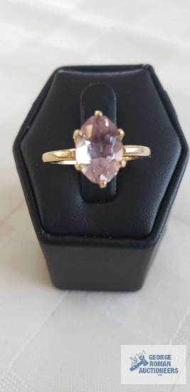 Gold colored ring with large diamond shaped pale purple stone, marked 14K, approximate total weight