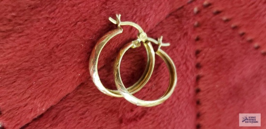 Gold colored hoop earrings, marked 10K, approximate total weight is 1.21 G