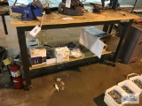 WORK TABLE WITH ELECTICAL OUTLETS AND CONTENTS ON BOTTOM SHELF