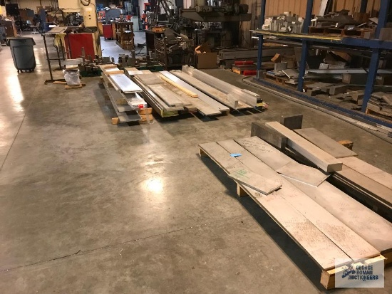 ALUMINUM SHEETS AND STEEL PIECES ON FLOOR AND ALONG THE WALL. RACK AND CONTENTS ON RACK NOT