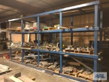 RACK AND CONTENTS ONLY. CONTAINING ALUMINUM AND STEEL STOCK....... MATERIAL ON FLOOR AND ALONG WALL 