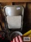 Seven metal folding chairs