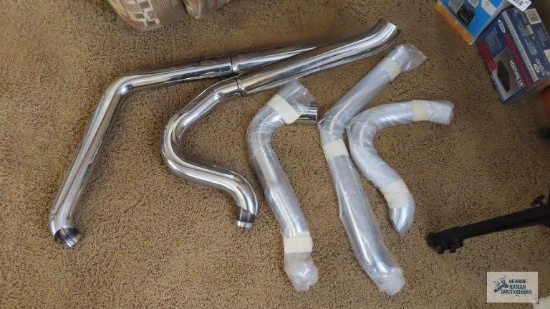 Motorcycle exhaust pipes and pieces.