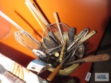 Bucket of commercial kitchen utensils