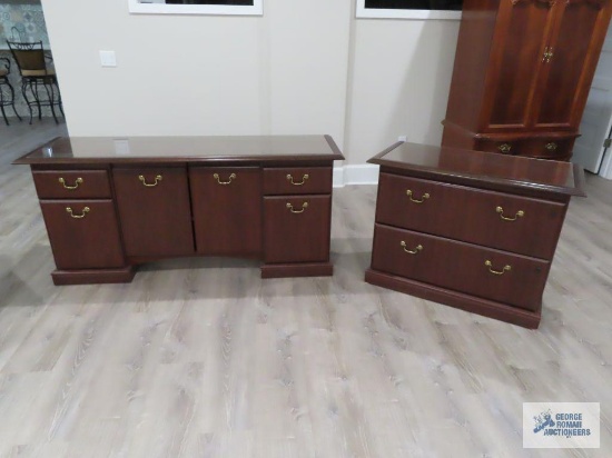 Cherry finish two drawer filing cabinet and credenza. Cabinet is 40" long by 21" wide by 30" tall.