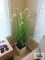 Woven planter with artificial plant