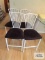 Four metal black padded seat bar stools