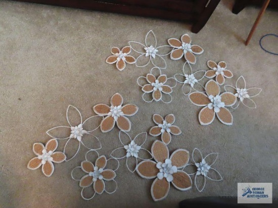 Two metal flower wall hangings