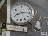 Taylor comfortmeter, Sterling & Noble clock, brass colored sword letter opener, and angel ornament
