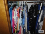 Various ladies clothes. Pants and dresses are sizes 8 and 10. Tops are mostly medium.