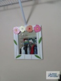 Decorative plastic wastebasket, Westminster wall clock, and small mirror