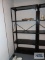Black metal adjustable shelving unit in basement