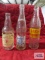 Three bottles including Frostie Old Fashioned, Swallow's Beverages, and Nehi Beverages