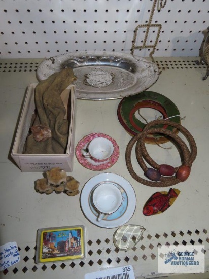 Variety of souvenir items, including world's fair plastic tray, teacups, saucers, cards