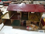 Metal dollhouse with plastic dollhouse accessories
