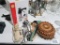 Electric knife, serving utensils, trivets, and other utensils. Biscuit machine, new in box.