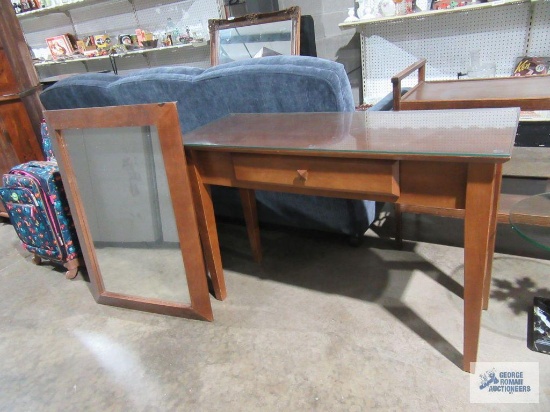 Sofa table with glass top and wall mirror