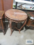 Decorative carved table with floral motif