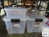 Three plastic totes with lids
