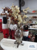 Metal with iridescent glass vase and floral arrangement