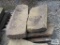 Four heavy sandstone blocks.