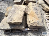 Four heavy sandstone blocks.
