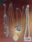 Gold colored costume jewelry necklaces, one Sarah Covington, one Trifari and silver colored beaded