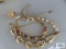 Variety of gold color bracelets, including Goldette Richelieu